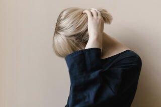https://unsplash.com/photos/woman-in-blue-shirt-covering-her-face-with-her-hair-jI8Kbjn-qxY